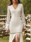 White lace V-neck maxi dress by FJØRNA with intricate lace details and flowing silhouette, perfect for evening occasions.