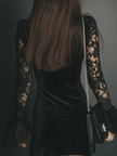 FJØRNA velvet mini dress, elegant evening dress with long sleeves and fitted silhouette, worn by a model on a runway.