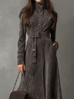 FJØRNA high neck belted suede midi dress featuring a fitted silhouette and elegant design, shown on a model.