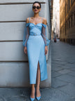 Light blue off-shoulder mesh-sleeve midi dress by FJØRNA, perfect for wedding guests, featuring elegant style and flowing fabric.