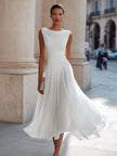 FJØRNA draped neck sleeveless pleated midi dress, elegant wedding guest dress with flowing fabric and classic silhouette.