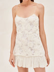 White Rosette Georgette Frilled Mini Dress by FJØRNA featuring delicate rosette details and ruffled frills, perfect for wedding guest attire.