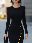 FJØRNA black long-sleeve fitted midi dress with gold buttons and slit, perfect for cocktail occasions.
