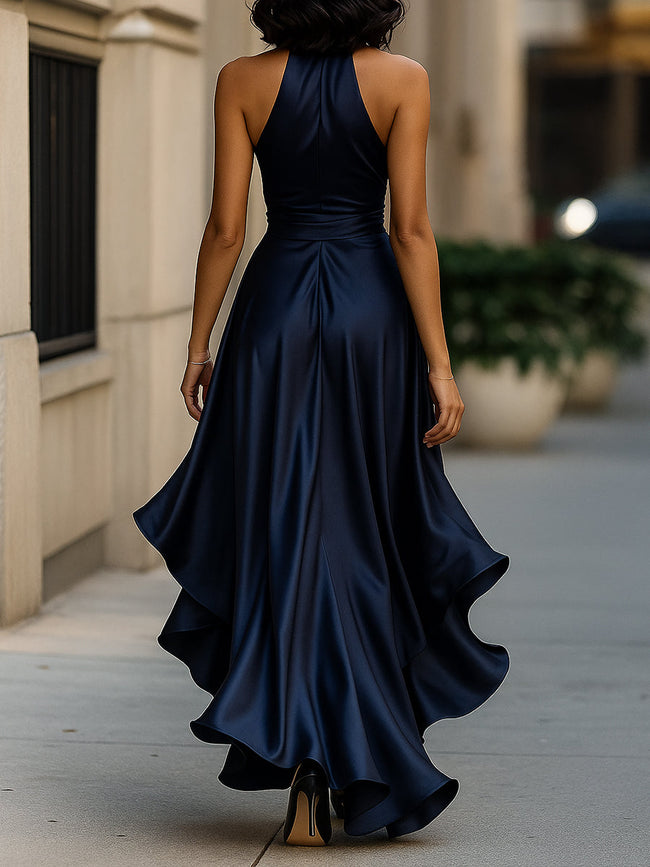 Navy satin halter ruffle gown by FJØRNA featuring elegant ruffles and a sleek satin finish, perfect for formal black tie events.