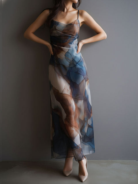 FJØRNA chiffon maxi dress for women, retro style with flowing fabric and elegant design, shown on a model.