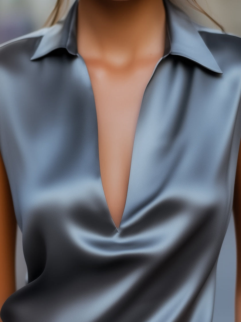 Gray satin women’s sleeveless plunge neck top by FJØRNA, minimalist design perfect for elegant, stylish occasions.