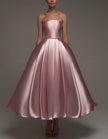 FJØRNA pink satin midi dress for women, strapless A-line style with shawl and strappy details, elegant evening dress image
