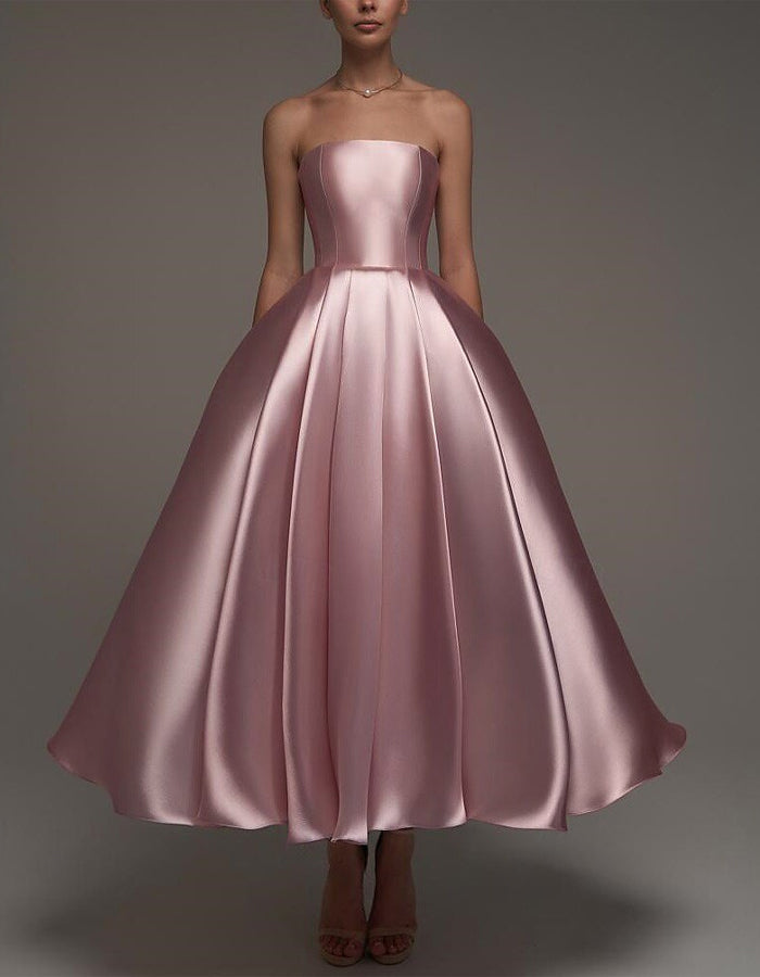 FJØRNA pink satin midi dress for women, strapless A-line style with shawl and strappy details, elegant evening dress image