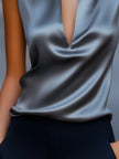 Gray satin women's top with plunge neck and sleeveless design, minimalist style by FJØRNA.