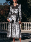 FJØRNA button-front belted midi coat dress for women, stylish dress with a tailored fit and classic design, shown on a model.
