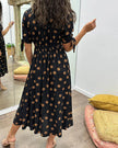 FJØRNA women's summer mini dress with polka dots and a V-neck, casual and stylish for warm weather.