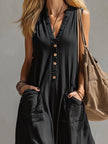 Black cotton linen sleeveless jumpsuit for women by FJØRNA, featuring wide-leg pants and a relaxed fit.