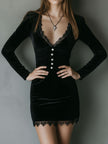 Black velvet V-neck mini dress by FJØRNA, showcasing a fitted evening dress with elegant V-shaped neckline and short sleeves.
