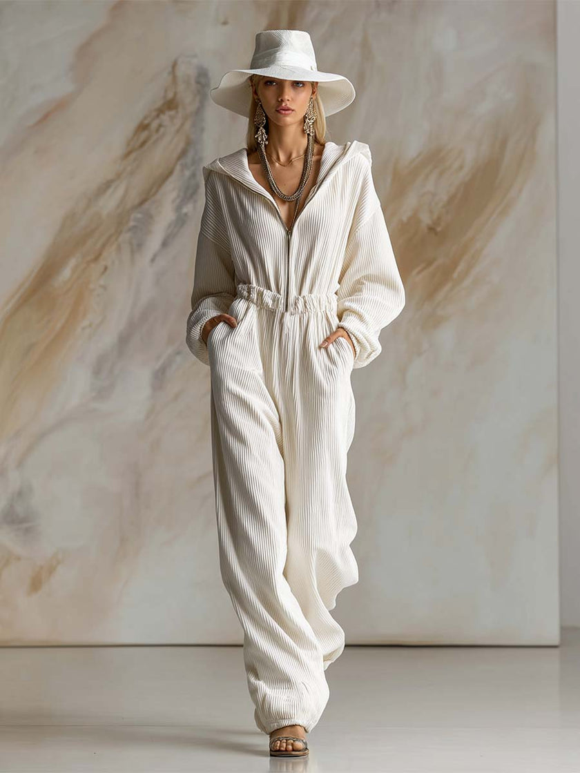 White corduroy hooded zip-front long sleeve jumpsuit for women by FJØRNA, featuring a stylish and comfortable design.