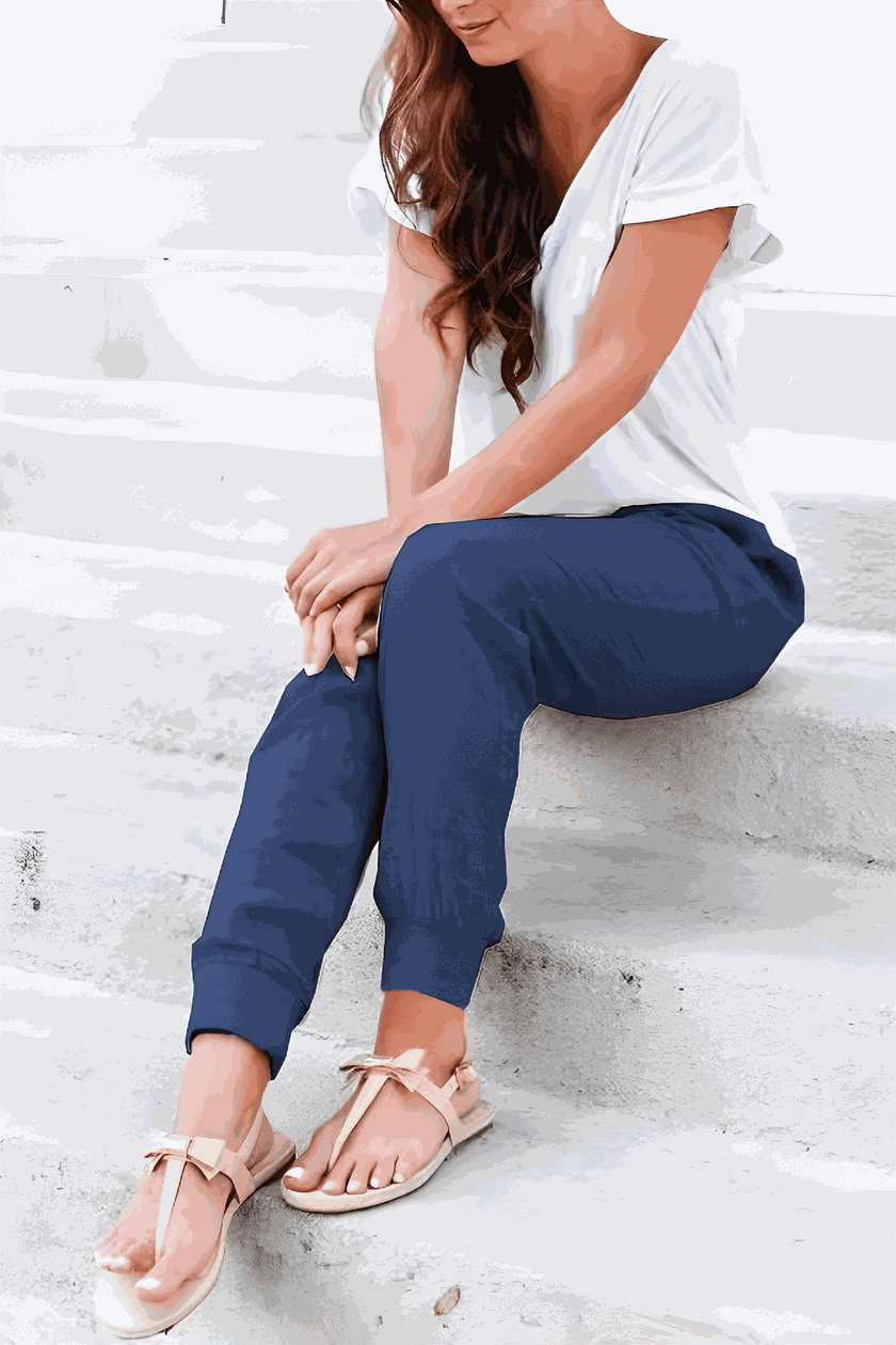 FJØRNA lightweight summer women's jogger pants with wide leg and tapered fit, casual trousers suitable for warm weather.