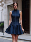 FJØRNA sleeveless high neck fit-and-flare mini cocktail dress displayed on a hanger with a plain background.