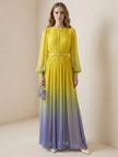 FJØRNA high waisted long sleeve maxi dress with belt, contrast gradient colors, pleated split-joint design, and round neck.