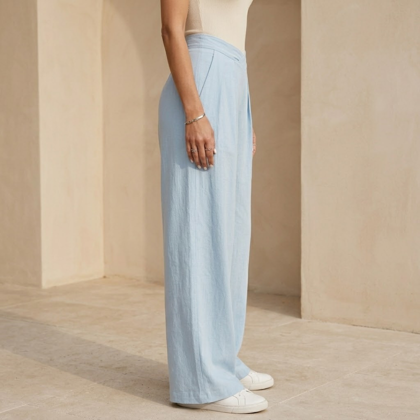 Women's loose pull-on wide-leg trousers with criss-cross waist detail from FJØRNA, showcasing relaxed fit and comfortable style.