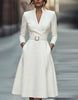 FJØRNA gold midi dress for women featuring a V-neck, A-line silhouette, and three-quarter sleeves, stylish and elegant.