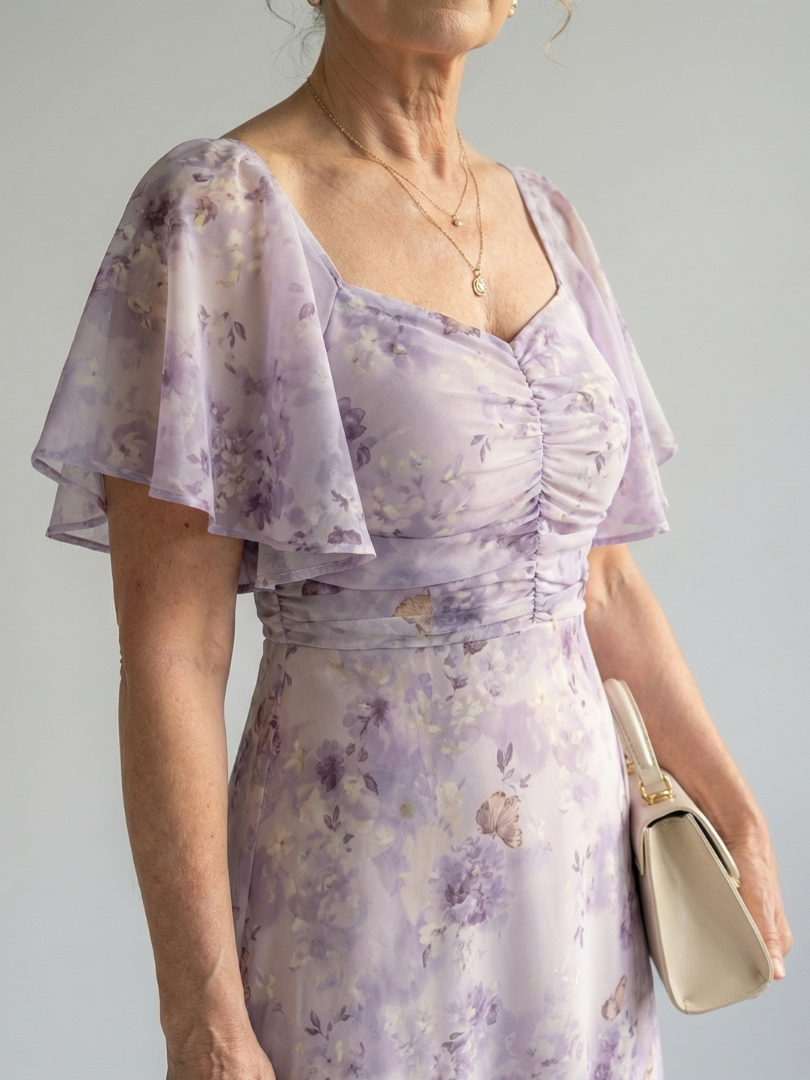 FJØRNA women's summer midi dress with floral pattern, square neckline, and flutter sleeves, perfect for warm weather.