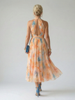 FJØRNA women's summer midi dress with halter neck, sleeveless, flowy lightweight fabric, perfect for warm weather.