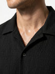 FJØRNA men's classic short-sleeve button-up shirt, casual summer tops, close-up of fabric and button details.