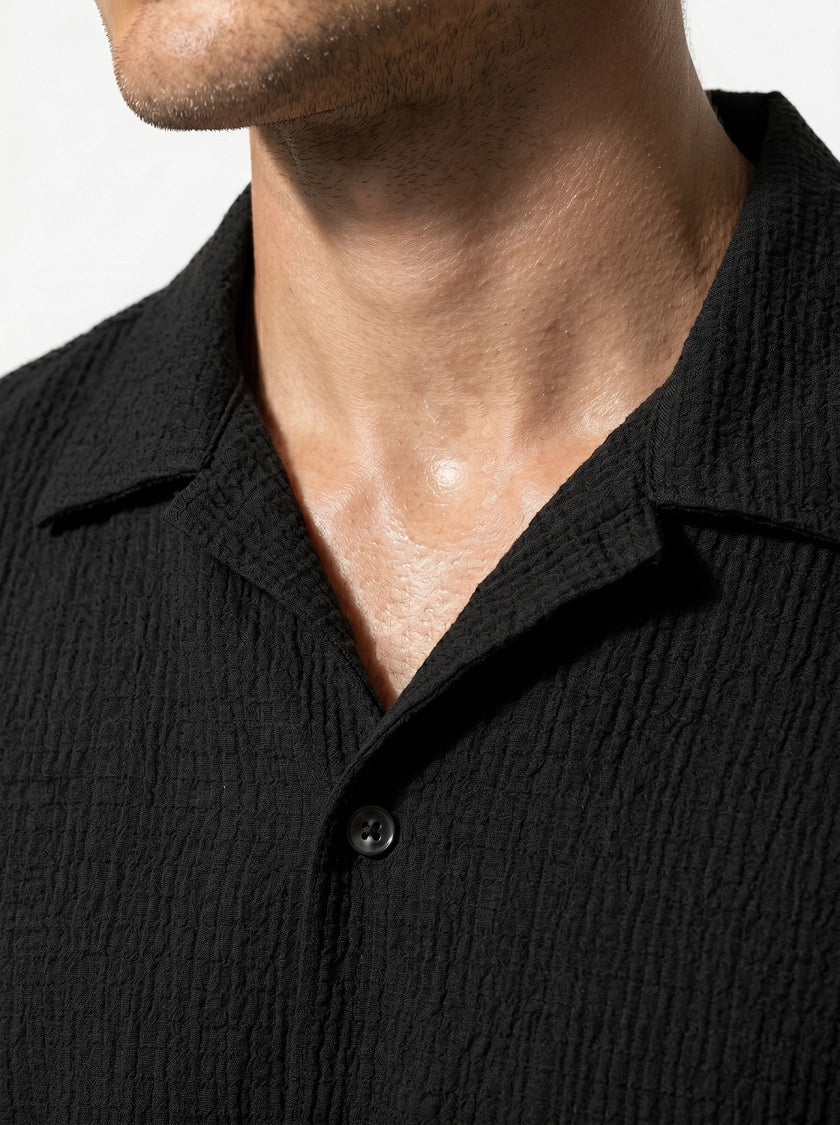 FJØRNA men's classic short-sleeve button-up shirt, casual summer tops, close-up of fabric and button details.