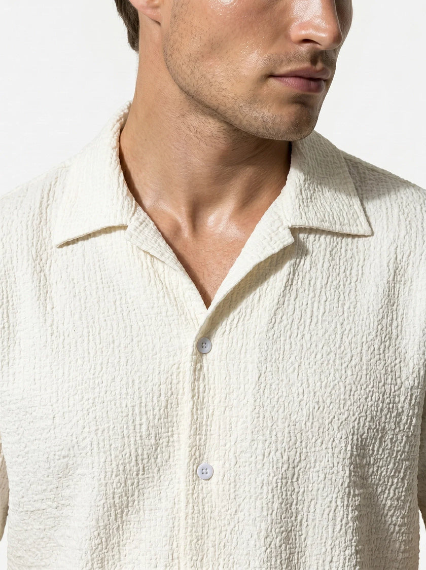 Close-up of FJØRNA men's casual summer short-sleeve button-up shirt, showing fabric texture and collar details.