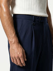Close-up of men's straight fit trousers by FJØRNA showing tailored fabric and classic design in a neutral color.