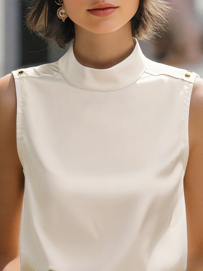 Ivory high-neck sleeveless satin blouse for women by FJØRNA, featuring a stylish white top with a fitted high neckline.