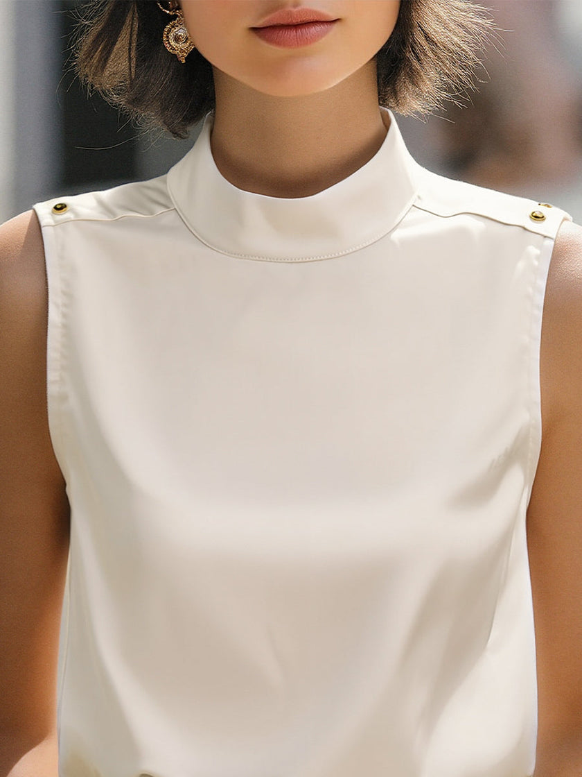 Ivory high-neck sleeveless satin blouse for women by FJØRNA, featuring a stylish white top with a fitted high neckline.
