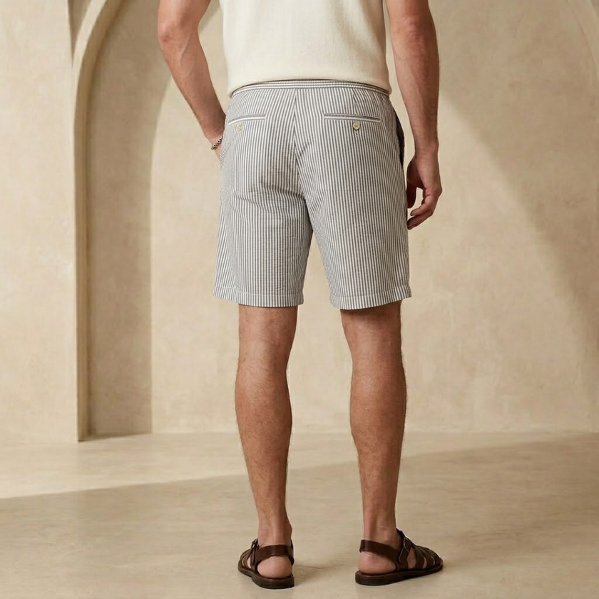 Men's striped drawstring relaxed shorts by FJØRNA, showing a casual summer style with breathable fabric and adjustable waist.