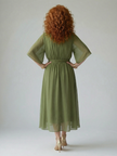 Flowy lightweight summer midi dress for women by FJØRNA, featuring a breezy, feminine design perfect for warm weather.