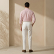 FJØRNA men's linen pleated straight-leg trousers, tailored pants with a relaxed fit and crisp pleats, in light natural linen fabric.