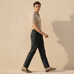 Blue FJØRNA men's straight-leg cotton trousers with slim fit design, shown on a mannequin, front view.