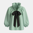FJØRNA gingham ruffle oversized women's blouse with long sleeves, featuring a relaxed fit and stylish ruffle details.