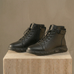 Men's black high-top leather Chelsea boots with side zipper by FJØRNA, featuring sleek design and sturdy sole.