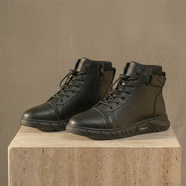 Men's black high-top leather Chelsea boots with side zipper by FJØRNA, featuring sleek design and sturdy sole.