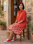 FJØRNA women's summer polka dot wrap dress, flowy and stylish, shown in a light, breezy fabric perfect for warm weather.