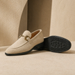 FJØRNA men's brown suede slip-on loafers showing smooth suede material and classic loafer design on a clean background.