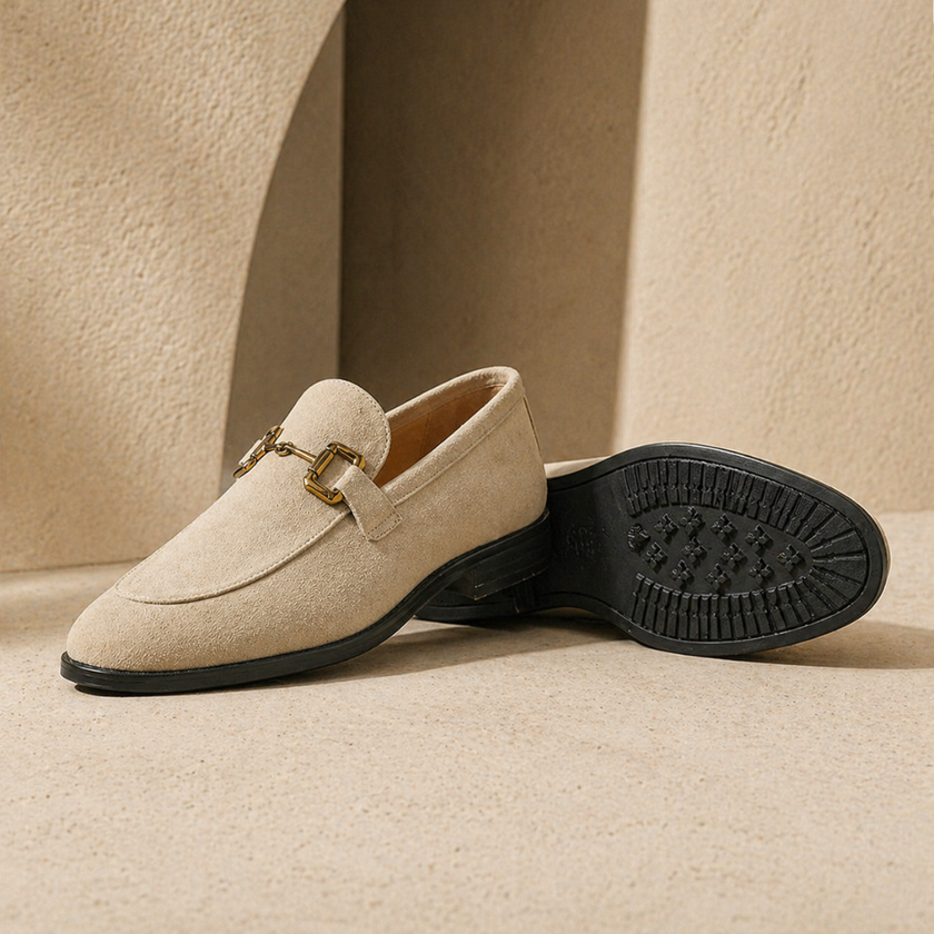 FJØRNA men's brown suede slip-on loafers showing smooth suede material and classic loafer design on a clean background.