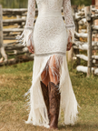 White lace V-neck maxi dress by FJØRNA, elegant evening dress with intricate lace details and flowing silhouette.