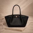 FJØRNA vegan leather medium waterproof tote bag with sturdy handles and spacious interior for work and daily use.