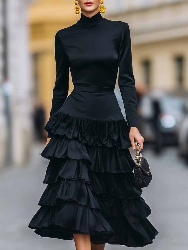 FJØRNA elegant mock neck tiered ruffle midi dress for women, showcasing a flowing design with layered ruffles and a fitted bodice.