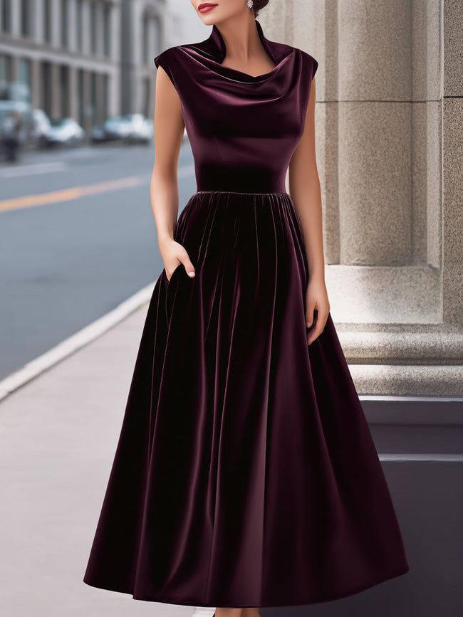 FJØRNA velvet cowl-neck sleeveless evening gown with an A-line silhouette and long sleeves, suitable for formal occasions.
