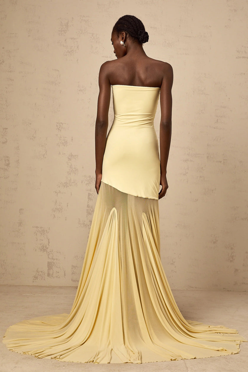 FJØRNA yellow off-shoulder sheer tulle maxi dress for women, elegant evening dress with flowing fabric and black tie detail.