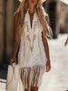 White denim tassel mini dress by FJØRNA, casual style with tassel details, sleeveless design, perfect for summer outings.