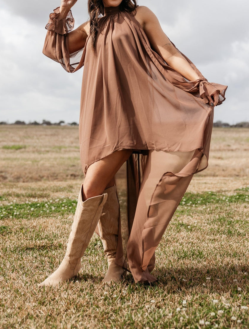 FJØRNA women's sleeveless maxi dress featuring a halter neckline and asymmetric hem, perfect for elegant summer occasions.