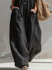 Black cotton linen sleeveless jumpsuit for women by FJØRNA, featuring a stylish, relaxed fit and modern design.