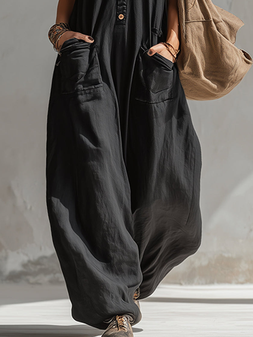 Black cotton linen sleeveless jumpsuit for women by FJØRNA, featuring a stylish, relaxed fit and modern design.